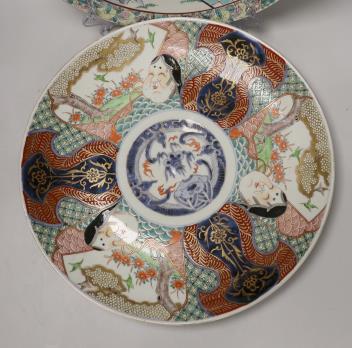 A pair of Japanese famille rose chargers and an Imari charger, largest 40.5cm diameter